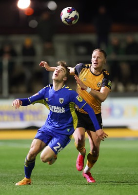 140323 - Newport County v AFC Wimbledon, EFL Sky Bet League 2 - Cameron Norman of Newport County takes on Jack Currie of AFC Wimbledon