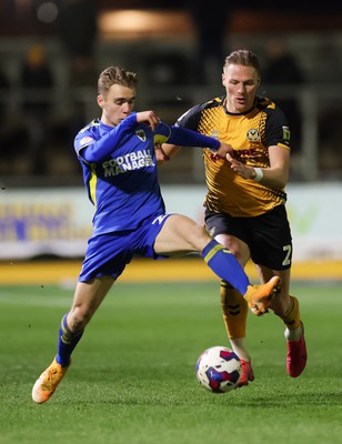 140323 - Newport County v AFC Wimbledon, EFL Sky Bet League 2 - Cameron Norman of Newport County takes on Jack Currie of AFC Wimbledon