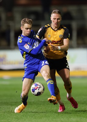 140323 - Newport County v AFC Wimbledon, EFL Sky Bet League 2 - Cameron Norman of Newport County takes on Jack Currie of AFC Wimbledon