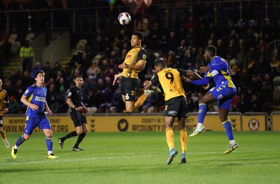 140323 - Newport County v AFC Wimbledon, EFL Sky Bet League 2 - Priestley Farquharson of Newport County looks to head at goal