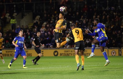 140323 - Newport County v AFC Wimbledon, EFL Sky Bet League 2 - Priestley Farquharson of Newport County looks to head at goal