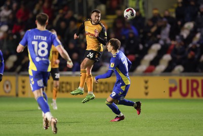 140323 - Newport County v AFC Wimbledon, EFL Sky Bet League 2 - Aaron Wildig of Newport County heads towards goal