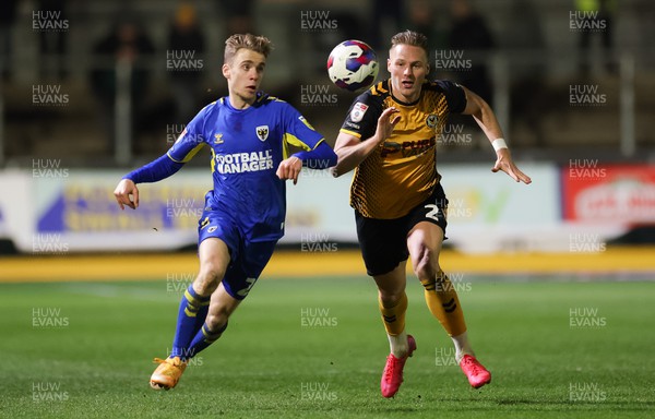 140323 - Newport County v AFC Wimbledon, EFL Sky Bet League 2 - Cameron Norman of Newport County takes on Jack Currie of AFC Wimbledon