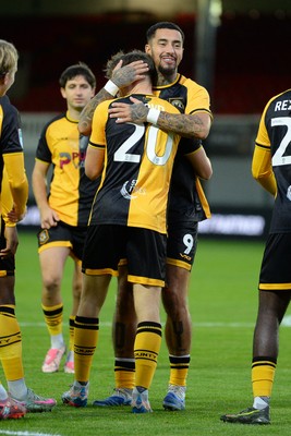 230925 - Newport County v Arsenal U21 - Vertu Trophy - Ben Lloyd of Newport County celebrates scoring a goal with team mates
