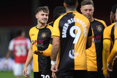 230925 - Newport County v Arsenal U21 - Vertu Trophy - Ben Lloyd of Newport County celebrates scoring a goal with team mates