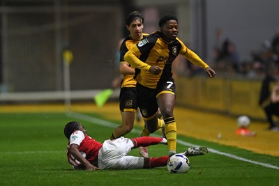 230925 - Newport County v Arsenal U21 - Vertu Trophy - Bobby Kamwa of Newport County is tackled by Josh Nicols of Arsenal U21s