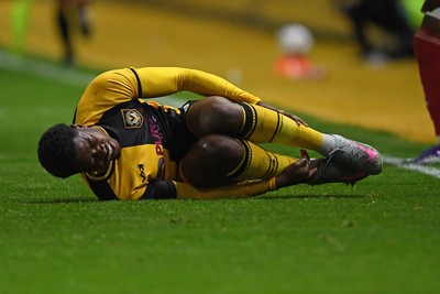 230925 - Newport County v Arsenal U21 - Vertu Trophy - Bobby Kamwa of Newport County is tackled by Josh Nicols of Arsenal U21s