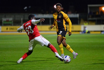 230925 - Newport County v Arsenal U21 - Vertu Trophy - Bobby Kamwa of Newport County is challenged by Charles Sagoe Jr of Arsenal U21s