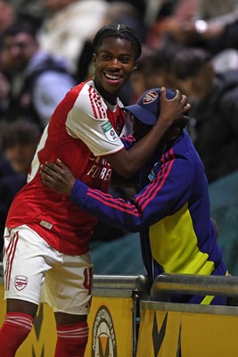 230925 - Newport County v Arsenal U21 - Vertu Trophy - Josh Nicols of Arsenal U21s is congratulated by Social Media figure and Arsenal Fan TV contributor, Tai Ogunlabi “Ty” as he leaves the field