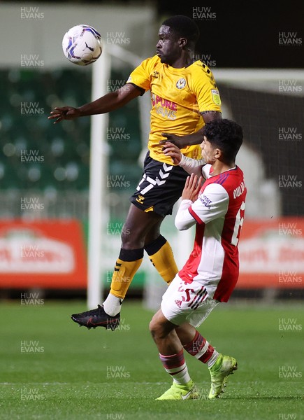 121021 - Newport County v Arsenal U21s - Papa Johns Trophy - Christopher Missilou of Newport County gets above Salah Oulad M�Hand of Arsenal U21s