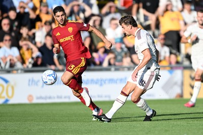 040826 - Newport County v AS Roma - Pre-Season Friendly - Harrison Biggins of Newport County has a shot from distance