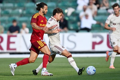 040826 - Newport County v AS Roma - Pre-Season Friendly - Harrison Biggins of Newport County is challenged by Mario Hermoso of Roma