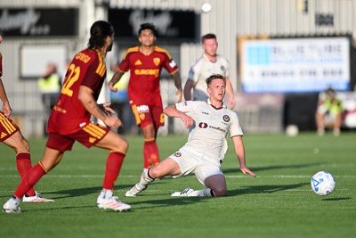 040826 - Newport County v AS Roma - Pre-Season Friendly - Matt Smith of Newport County is challenged by Mario Hermoso of Roma
