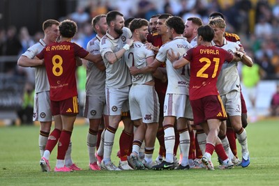 040826 - Newport County v AS Roma - Pre-Season Friendly - Things boil over between the two sides after Cameron Evans of Newport County fouls Paulo Dybala of Roma