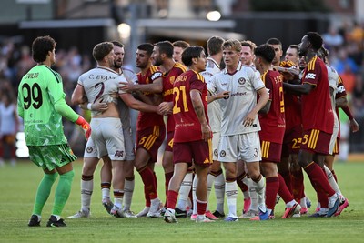 040826 - Newport County v AS Roma - Pre-Season Friendly - Things boil over between the two sides after Cameron Evans of Newport County fouls Paulo Dybala of Roma