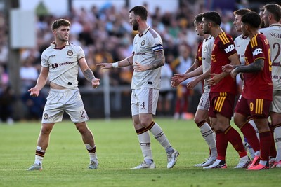 040826 - Newport County v AS Roma - Pre-Season Friendly - Things boil over between the two sides after Cameron Evans of Newport County fouls Paulo Dybala of Roma
