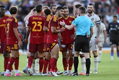 040826 - Newport County v AS Roma - Pre-Season Friendly - Things boil over between the two sides after Cameron Evans of Newport County fouls Paulo Dybala of Roma