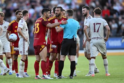 040826 - Newport County v AS Roma - Pre-Season Friendly - Things boil over between the two sides after Cameron Evans of Newport County fouls Paulo Dybala of Roma