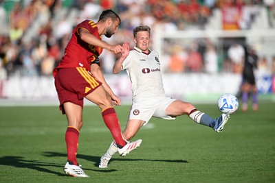 040826 - Newport County v AS Roma - Pre-Season Friendly - Matt Smith of Newport County is challenged by Gianluca Mancini of Roma