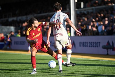 040826 - Newport County v AS Roma - Pre-Season Friendly - Harrison Biggins of Newport County is challenged by Mario Hermoso of Roma