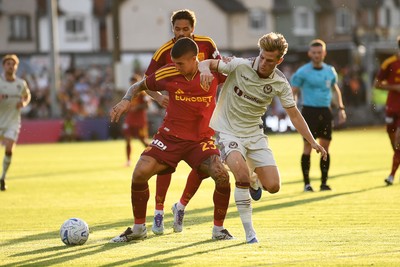 040826 - Newport County v AS Roma - Pre-Season Friendly - Tom Davies of Newport County is challenged by Gianluca Mancini of Roma
