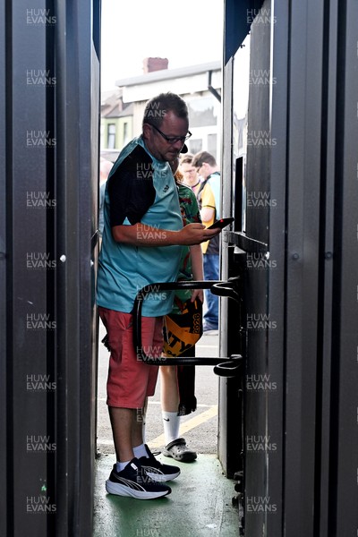 040826 - Newport County v AS Roma - Pre-Season Friendly - Fans arrive through the turnstiles