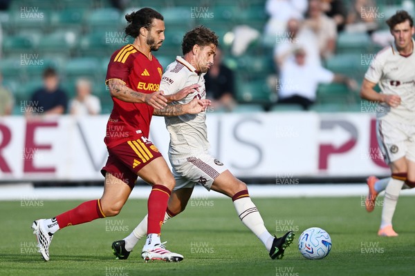 040826 - Newport County v AS Roma - Pre-Season Friendly - Harrison Biggins of Newport County is challenged by Mario Hermoso of Roma
