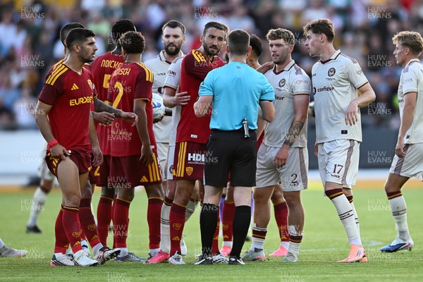 040826 - Newport County v AS Roma - Pre-Season Friendly - Things boil over between the two sides after Cameron Evans of Newport County fouls Paulo Dybala of Roma
