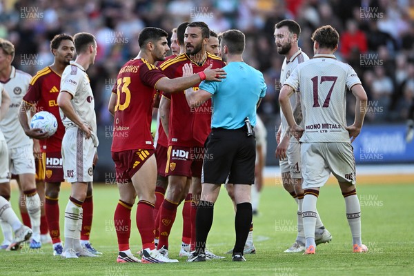 040826 - Newport County v AS Roma - Pre-Season Friendly - Things boil over between the two sides after Cameron Evans of Newport County fouls Paulo Dybala of Roma