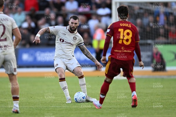 040826 - Newport County v AS Roma - Pre-Season Friendly - Kyle Cameron of Newport County is challenged by Matias Soule of Roma