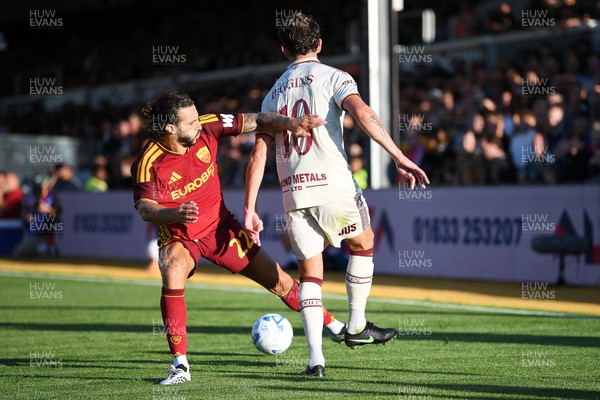 040826 - Newport County v AS Roma - Pre-Season Friendly - Harrison Biggins of Newport County is challenged by Mario Hermoso of Roma