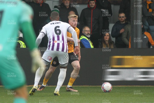 021223 - Newport County v Barnet - FA Cup Second Round - Will Evans of Newport County takes on Jerome Okimo of Barnet