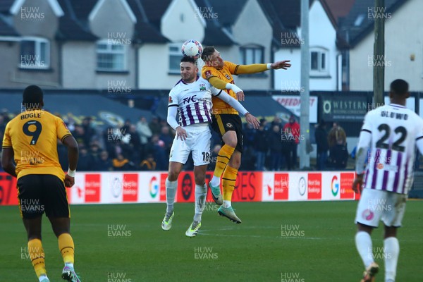 021223 - Newport County v Barnet - FA Cup Second Round - Scot Bennett of Newport County beats Anthony Hartigan of Barnet in the air