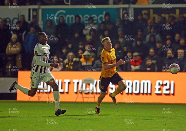 021223 - Newport County v Barnet - FA Cup Second Round - Will Evans of Newport County takes on Adebola Oluwo of Barnet