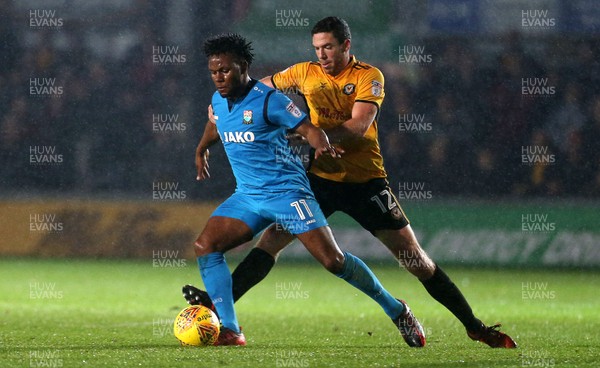 211117 - Newport County v Barnet - SkyBet League Two - Shaquile Coulthirst of Barnet is challenged by Ben Tozer of Newport County