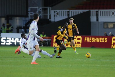261225 - Newport County v Barnet - Sky Bet League 2 - Nathaniel Opoku of Newport County is tackled by Nnamdi Ofoborth of Barnet