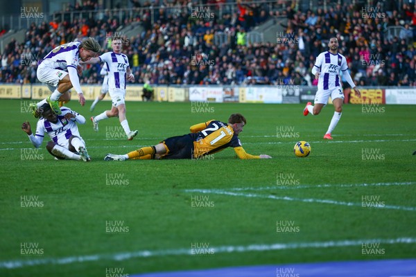 261225 - Newport County v Barnet - Sky Bet League 2 - Michael Spellman of Newport County goes to ground under a tackle by Idris Kanu of Barnet