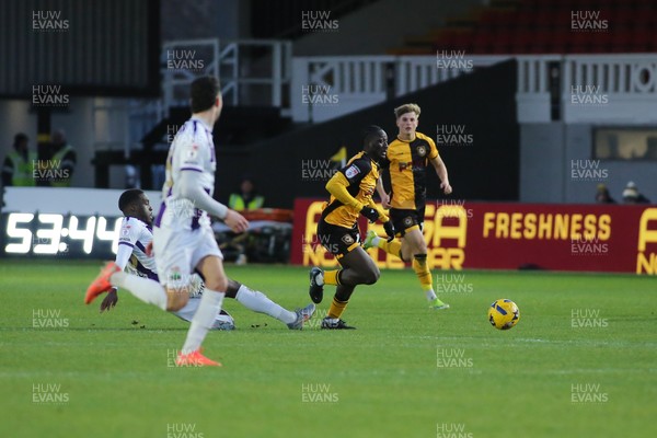 261225 - Newport County v Barnet - Sky Bet League 2 - Nathaniel Opoku of Newport County is tackled by Nnamdi Ofoborth of Barnet
