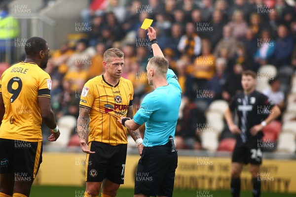160923 - Newport County v Barrow - Sky Bet League 2 - Scot Bennett of Newport County receives a yellow card from referee Martin Coy