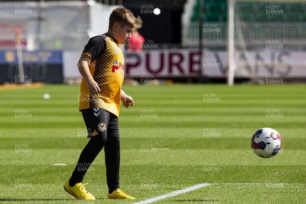 170922 - Newport County v Barrow - Sky Bet League 2 - A young Newport supporter plays on the pitch during the warm up