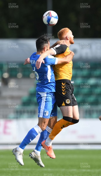 190920 - Newport County v Barrow - EFL SkyBet League 2 - Sam Hird of Barrow and Ryan Taylor of Newport County compete in the air