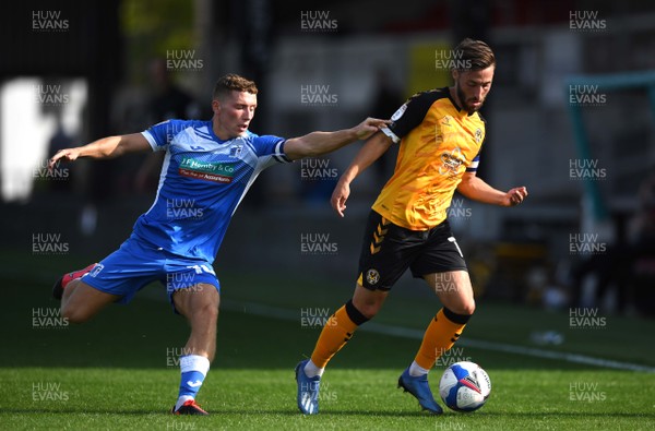 190920 - Newport County v Barrow - EFL SkyBet League 2 - Robbie Willmott of Newport County is tackled by Lewis Hardcastle of Barrow
