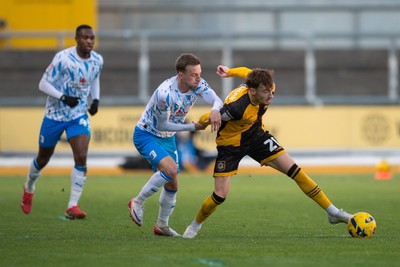 291125 - Newport County v Barrow - Sky Bet League 2 - Michael Spellman of Newport County beats Elliot Newby of Barrow