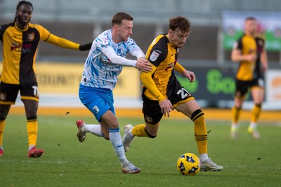 291125 - Newport County v Barrow - Sky Bet League 2 - Michael Spellman of Newport County beats Elliot Newby of Barrow
