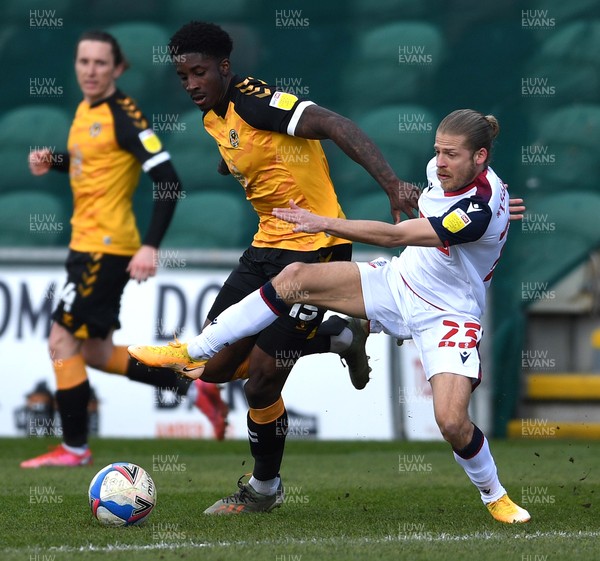 050421 - Newport County v Bolton Wanderers - EFL SkyBet League 2 - Lloyd Isgrove of Bolton is tackled by David Longe-King of Newport County