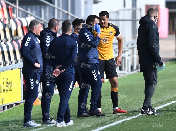 050421 - Newport County v Bolton Wanderers - EFL SkyBet League 2 - Priestley Farquharson of Newport County  leaves the field with medical staff