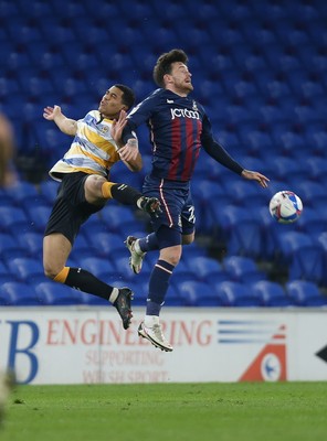 090321 Newport County v Bradford City, Sky Bet League 2 - Priestley Farquharson of Newport County and Andy Cook of Bradford City compete for the ball