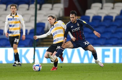 090321 Newport County v Bradford City, Sky Bet League 2 - Aaron Lewis of Newport County and Levi Sutton of Bradford City compete for the ball