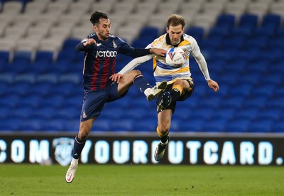 090321 Newport County v Bradford City, Sky Bet League 2 - Mickey Demetriou of Newport County is challenged by Levi Sutton of Bradford City