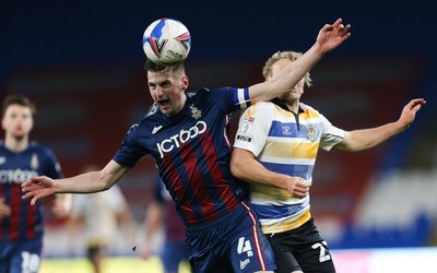 090321 Newport County v Bradford City, Sky Bet League 2 - Paudie O'Connor of Bradford City is challenged by Jake Scrimshaw of Newport County